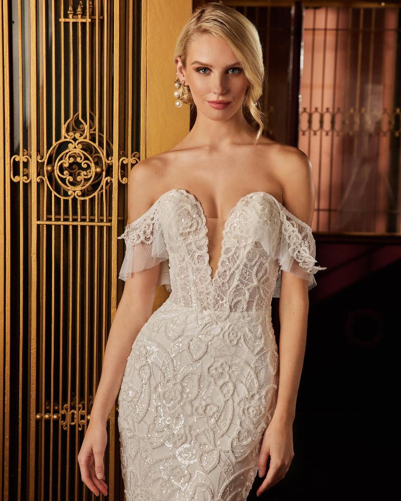 122109 fitted sparkly wedding dress with sleeves and plunging neckline2